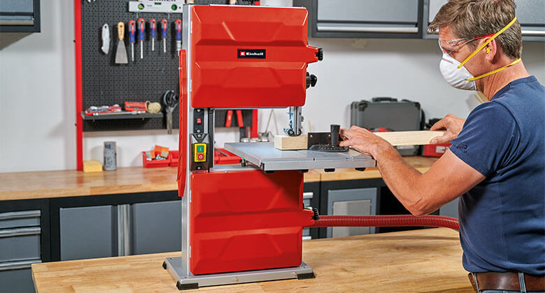 man using a band saw